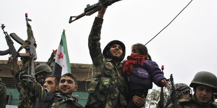 Suriya ordusu YPG-nin silahlarını təhvil alır
